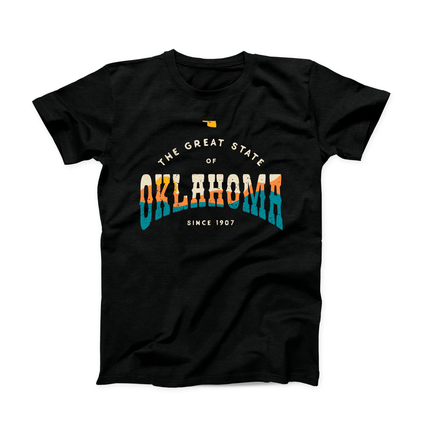 Black Oklahoma t-shirt. Small Oklahoma state shape at the top in yellow gold. "The Great State of Oklahoma since 1907" listed under the state. "Oklahoma" is the largest font on the shirt with a sunset over hills shown within the word in cream, yellow, orange, and teal.