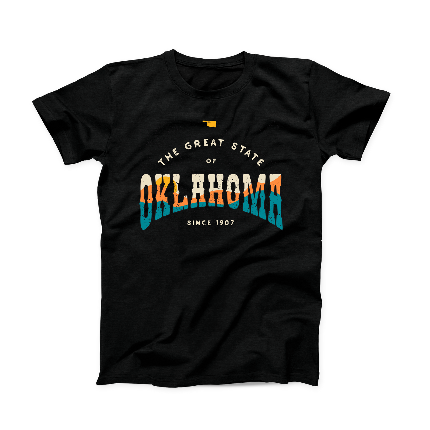 Black Oklahoma t-shirt. Small Oklahoma state shape at the top in yellow gold. "The Great State of Oklahoma since 1907" listed under the state. "Oklahoma" is the largest font on the shirt with a sunset over hills shown within the word in cream, yellow, orange, and teal. 