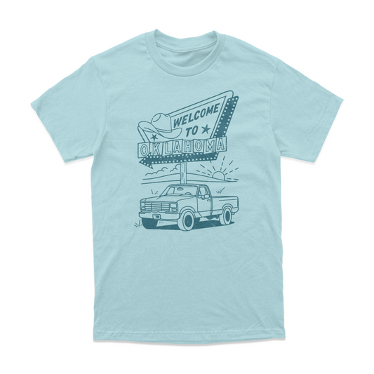 Front of Welcome to Oklahoma T-shirt with roadside sign and vintage truck on a light blue shirt