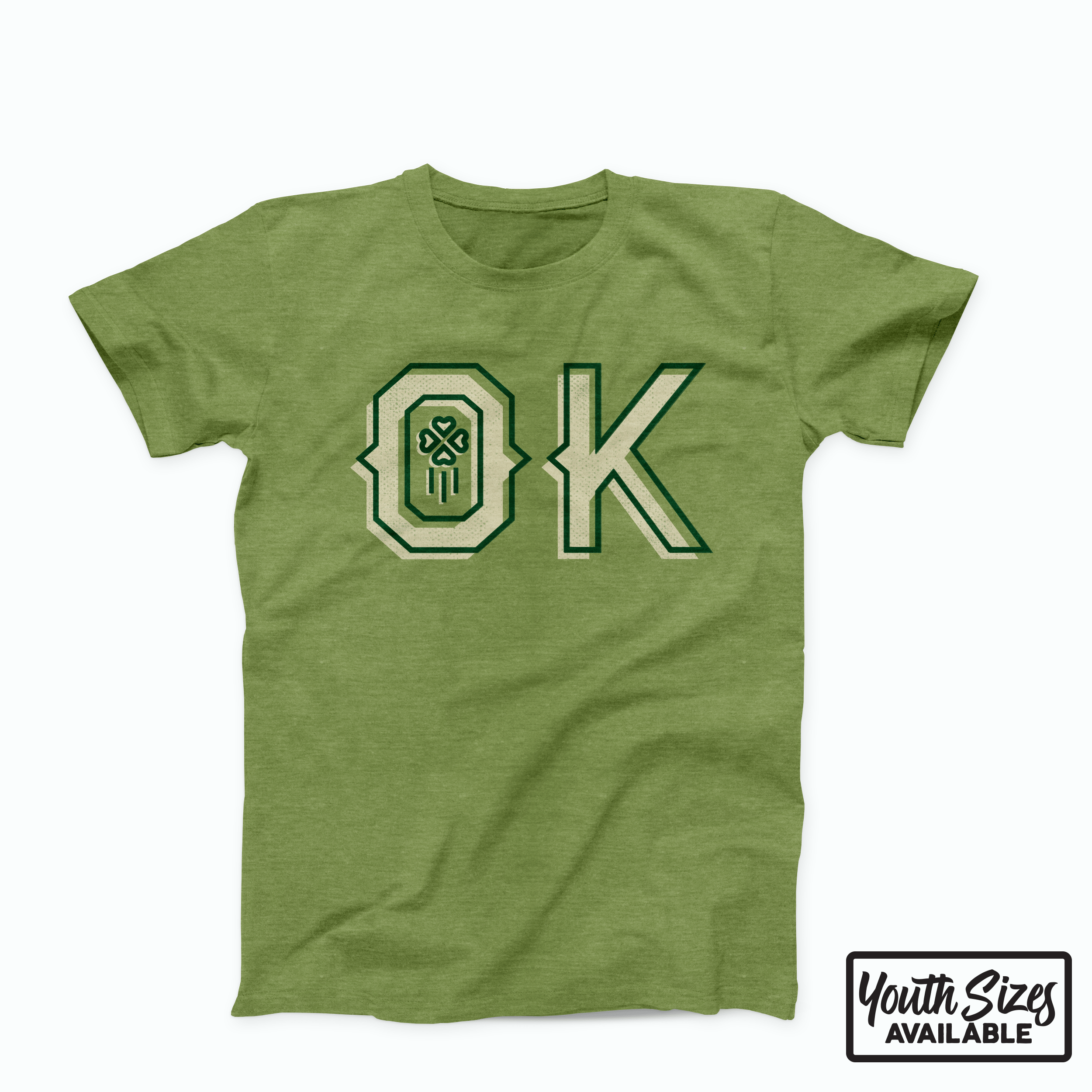 Heather green t-shirt with western “OK” design and shamrock accent, March 2019 Oklahoma Shirt of the Month