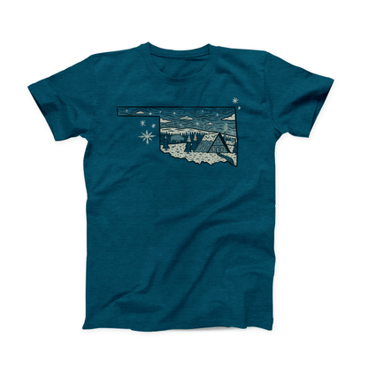 Deep Teal colored Oklahoma T-shirt. A white and black design shows a snowy cabin scene inside of the shape of the state.