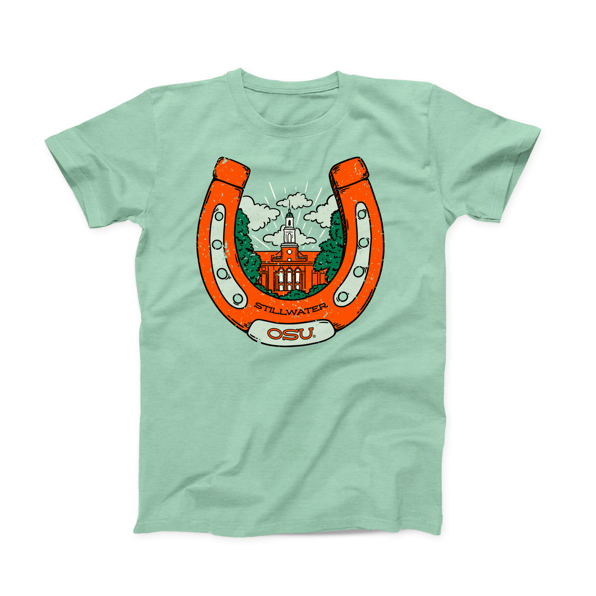 Mint green colored OSU T-shirt. Screen printed in orange is a large, upright horseshoe with "Stillwater" in small black font at the bottom, with "OSU" a little larger below that on the horseshoe. Inside the horseshoe is the Edmon Low Library building surrounded by green trees and white clouds.  