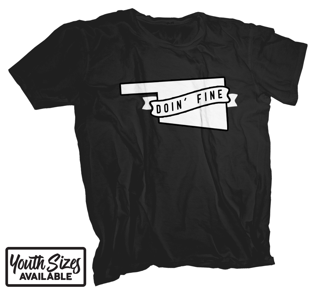 A solid black colored Oklahoma t-shirt. Screen printed in white across the chest is the shape of the state with a ribbon wrapped across it that reads "Doin' Fine"