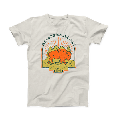 Natural colored Oklahoma T-shirt. Screen printed in gold, orange and navy. An orange bison is depicted in front of a gold canyon with the sun's rays shining behind it. In thin, curved font above the scene is "OKLAHOMA SPIRIT" in navy. And below the scene is "Est. 1907" in small font.