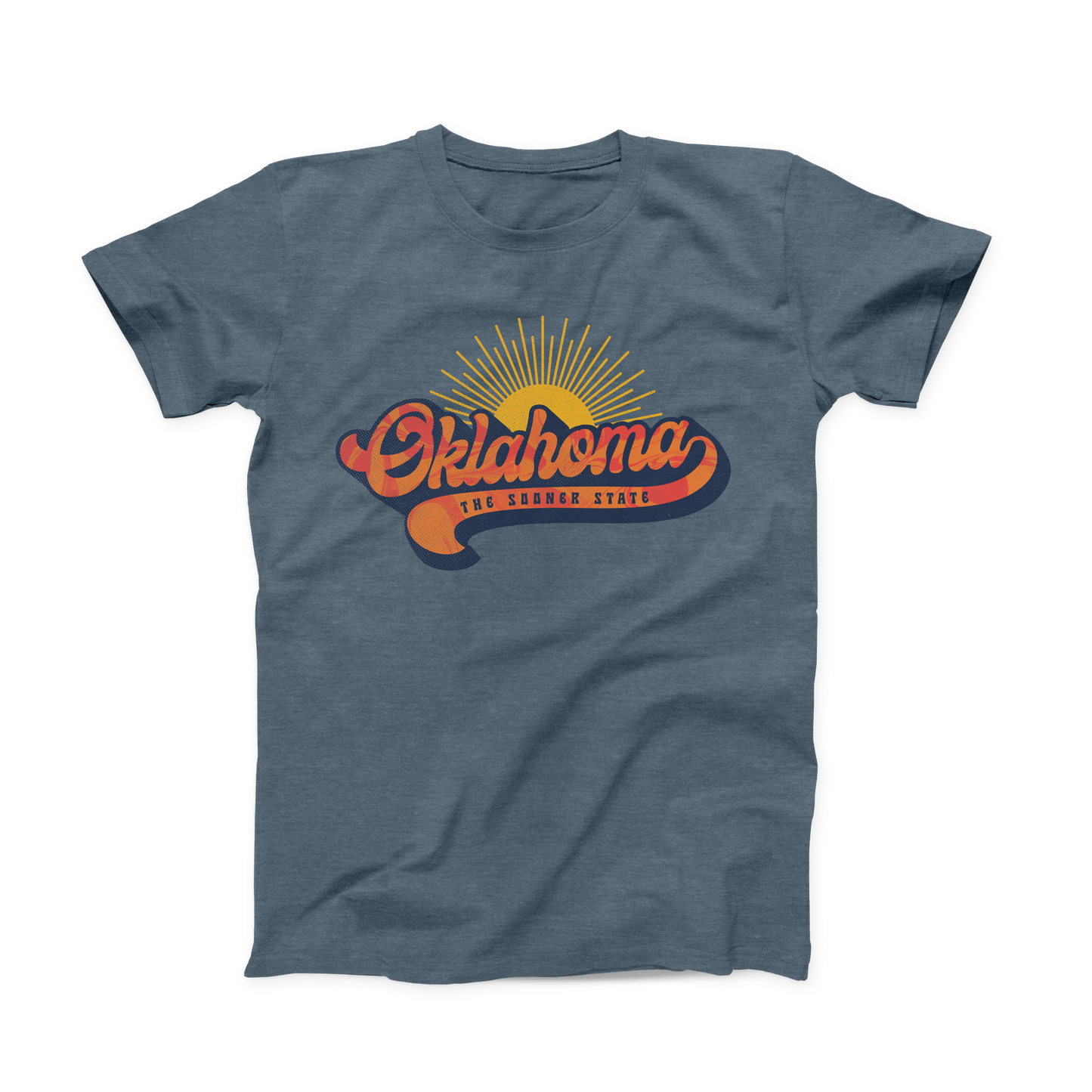 Heather Slate colored Oklahoma T-shirt. Screen printed across the chest in yellow, orange, red and navy. "Oklahoma" is written is a rounded orange and red font outlined in navy with a yellow sun behind it. "The Sooner State" is listed below in small navy font within the tail of the "a"