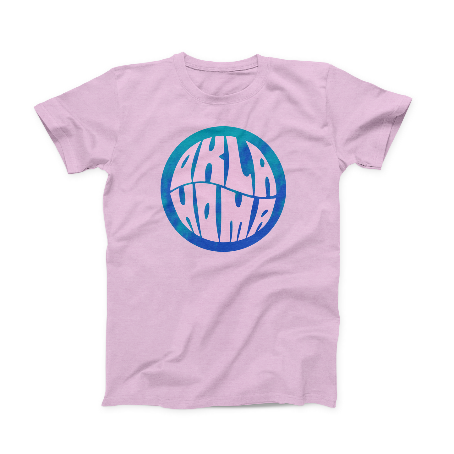 Lilac colored Oklahoma T-shirt. Screen printed in a pixelated circle of teal and blue is "OKLA" stacked atop "HOMA" in a curvy font to fill the whole space of the circle. 