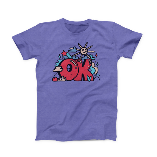 Heather Lapis colored Oklahoma T-shirt. Screen printed with a cartoonish "Schoolhouse Rock" style in red, teal, blue, and soft yellow. The design depicts a large "OK" print with a smiling sun above it, and clouds and stars around it. 