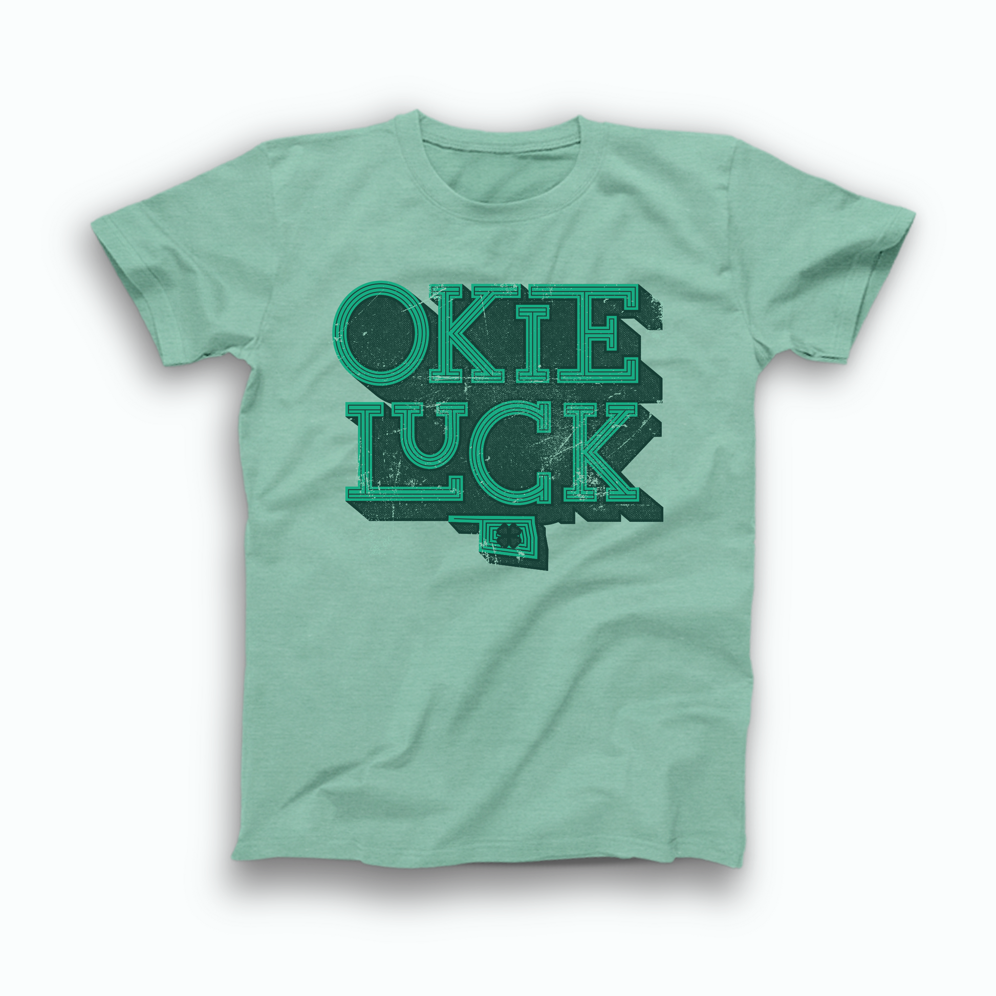 Mint green colored Oklahoma T-shirt. Screen printed in a distressed, vintage style in green with a dark green background is "OKIE" stacked atop "LUCK" with a small OK state symbol below and a 4 leaf clover inside the state. 